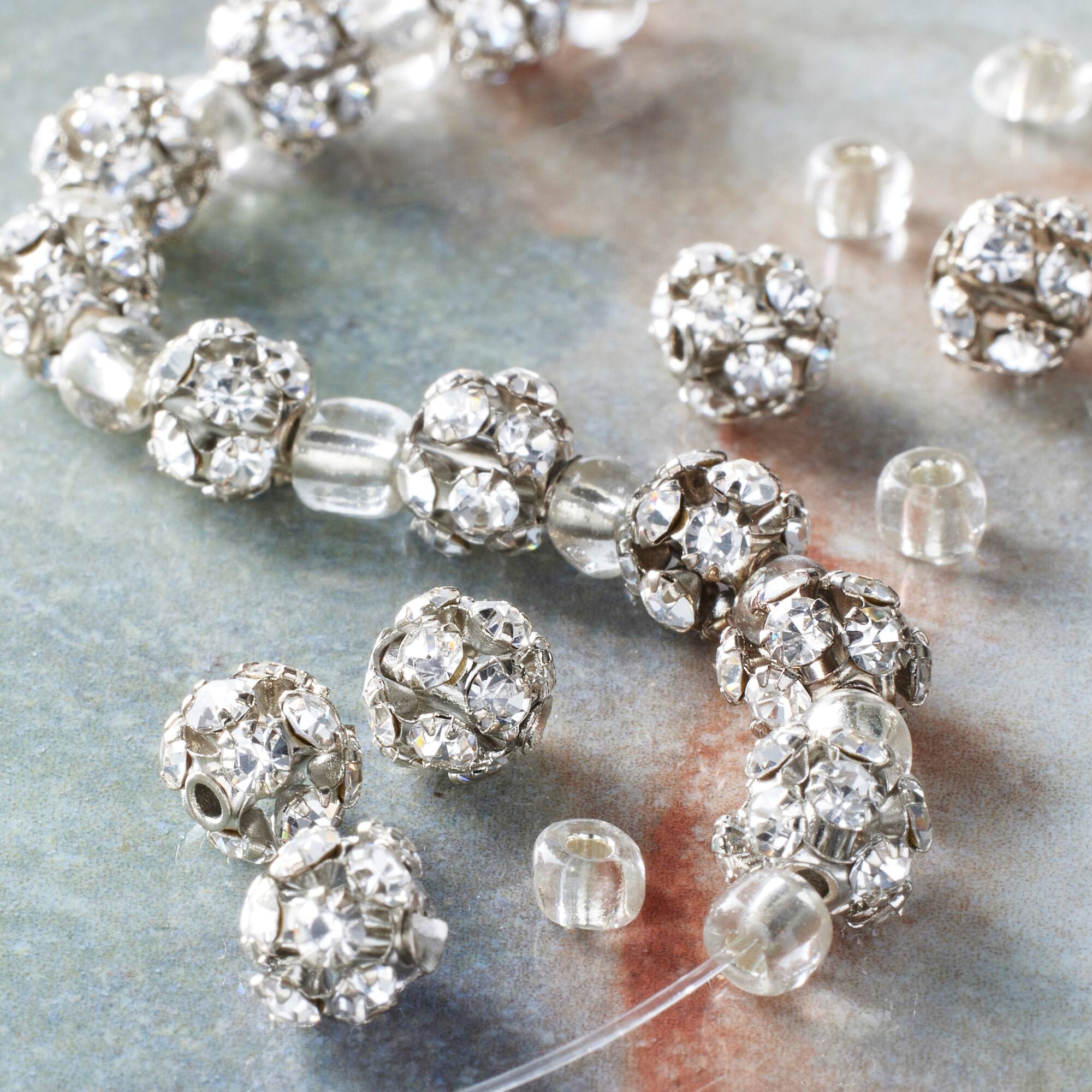 12 Pack: Silver Rhinestone Studded Round Beads, 6mm by Bead Landing™
